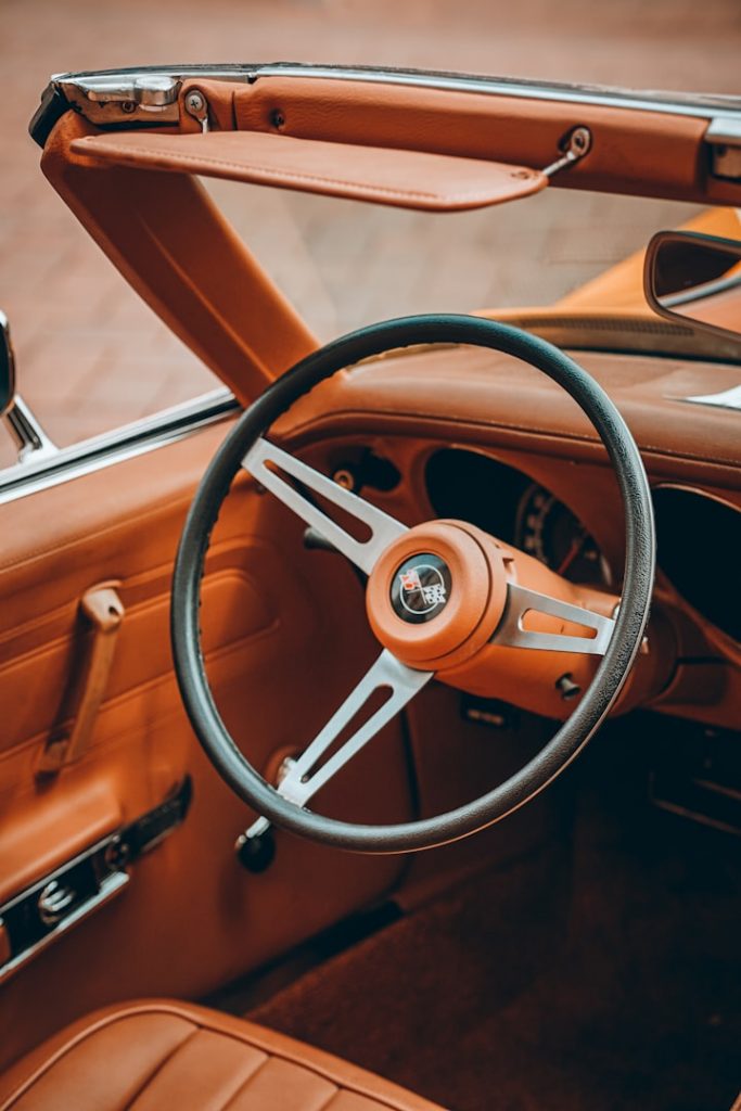 The Steering Wheel of Your Soul - A vintage golden steering wheel surrounded by soft pink clouds and crystals in Versailles style.