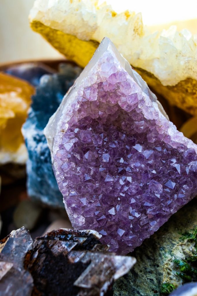 The illusion of polished stones - Versailles style art showing gold and pink fractured crystals.