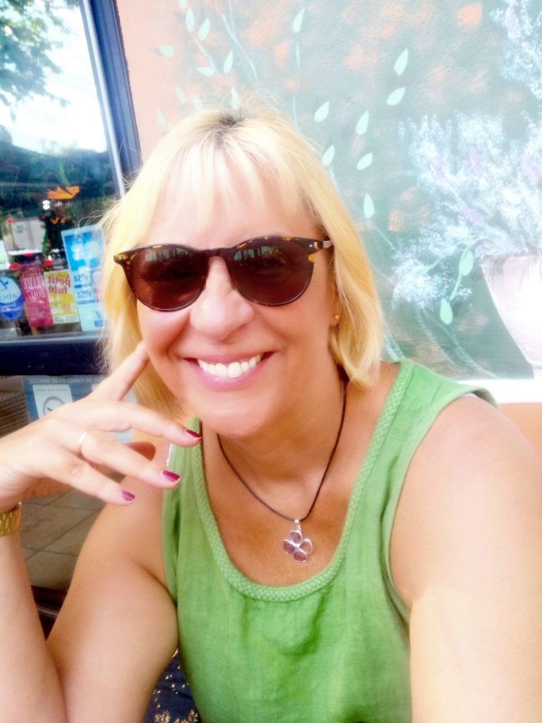 Sanja wearing her new amethyst flower pendant reflecting Azure Equilibrium
